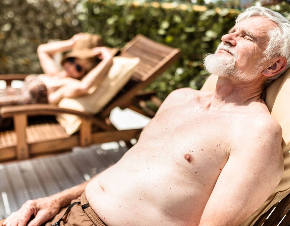Old man sunbathing